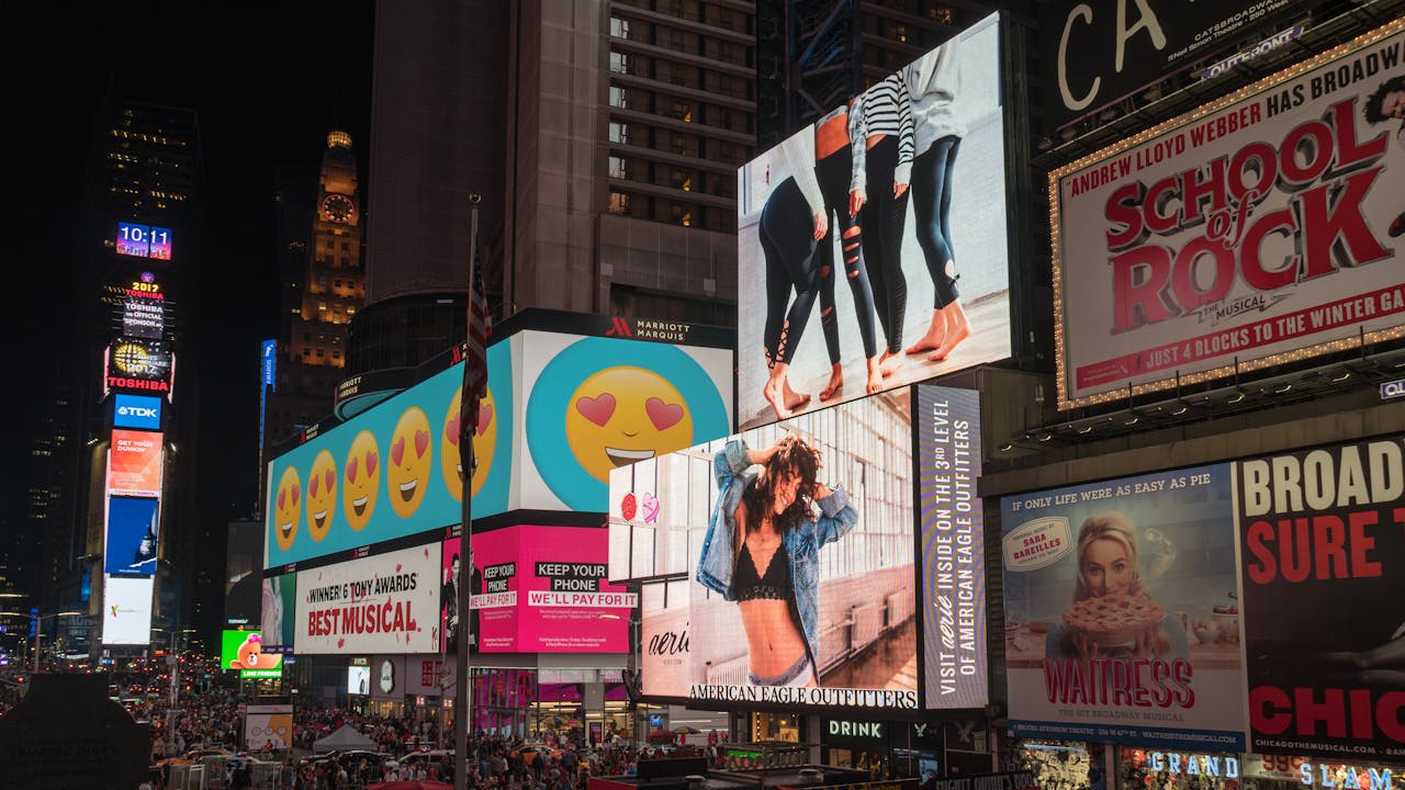 Mastering the First Impression: Your intriguing post title goes here Colorful billboards light up New York City's iconic Times Square at night, with vibrant ads and bustling crowds.